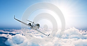 Concept of black luxury generic design private jet flying in blue sky at sunset. Huge white clouds background. Business