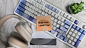 Concept of Blended Learning write on sticky notes isolated on Wooden Table