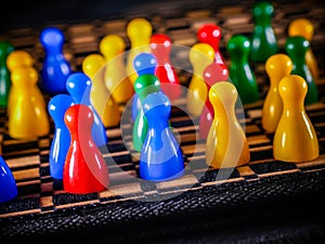 The concept of board games. Dice, chips and cards on a yellow background