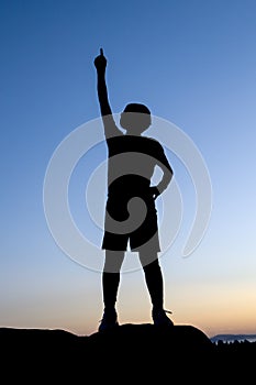 Concept of boy pointing to the sky