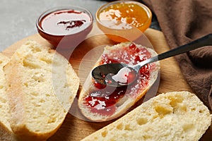 Concept of breakfast with toast with jam on black smokey background