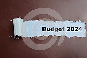 Concept of Budget 2024 Text written in torn paper