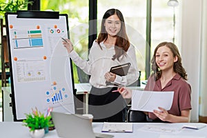 Concept of business office woman working,Businesswoman smile while working about her invesment plan with analyzing document and