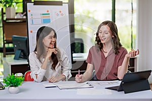 Concept of business office woman working,Businesswoman smile while working about her invesment plan with analyzing document and