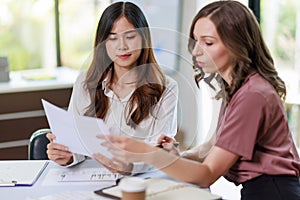 Concept of business office woman working,Businesswoman smile while working about her invesment plan with analyzing document and