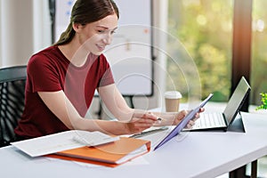 Concept of business office woman working,Businesswoman smile while working about her invesment plan with analyzing document and