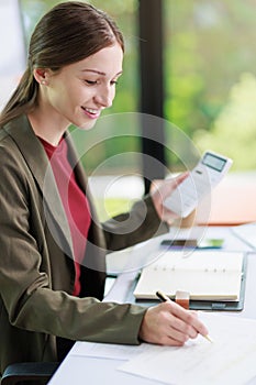 Concept of business office woman working,Businesswoman smile while working about her invesment plan with analyzing document and