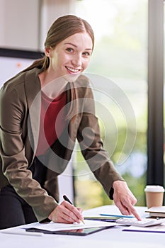 Concept of business office woman working,Businesswoman smile while working about her invesment plan with analyzing document and