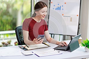 Concept of business office woman working,Businesswoman smile while working about her invesment plan with analyzing document and