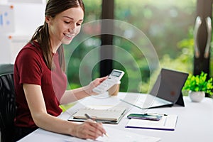 Concept of business office woman working,Businesswoman smile while working about her invesment plan with analyzing document and