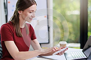 Concept of business office woman working,Businesswoman smile while working about her invesment plan with analyzing document and