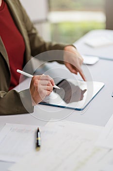 Concept of business office woman working,Businesswoman smile while working about her invesment plan with analyzing document and