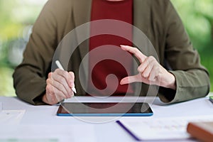 Concept of business office woman working,Closeup businesswoman checking her invesment plan with analyzing document and business