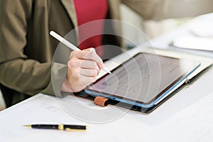 Concept of business office woman working,Closeup businesswoman checking her invesment plan with analyzing document and business