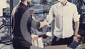 Concept of business partnership handshake.Closeup photo two businessmans handshaking process.Successful deal after great