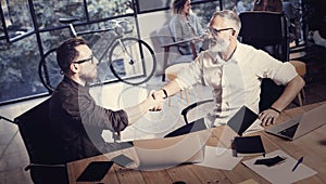 Concept of business partnership handshake.Photo two bearded businessmans handshaking process.Successful deal after great