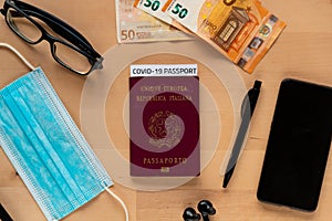 Concept of business travel with covid vaccination passport with covid19 immunity passport. hand sanitizer and mobile phone and