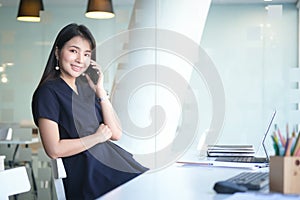 Concept business woman working and people happy businesswoman or creative female office worker with computers writing to notebook