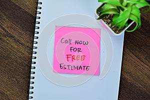 Concept of Call Now For FREE Estimate write on sticky notes isolated on Wooden Table