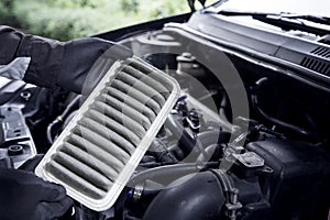 Concept of car care service maintenance, the car air filter is old and dirty with dust stains for checking cleaning and replacing