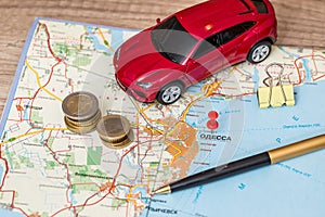 Concept of car journey, map and money