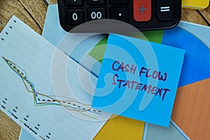Concept of Cash Flow Statement write on sticky notes isolated on Wooden Table