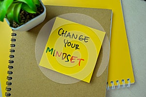 Concept of Change Your Mindset write on sticky notes isolated on Wooden Table