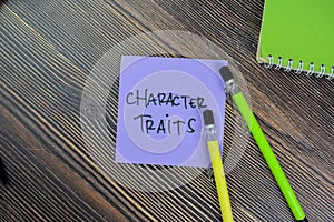 Concept of Character Traits write on sticky notes isolated on Wooden Table