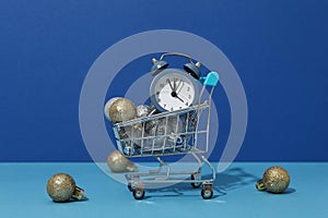 Concept of Christmas shopping time with alarm clock