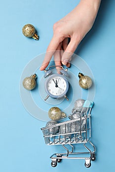 Concept of Christmas shopping time with alarm clock