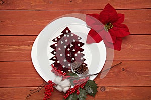 Concept of a Christmas tree on a white plate. beet. snowflakes. new year branch with