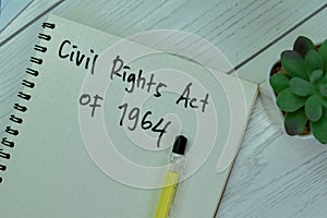 Concept of Civil Rights Act of 1964 write on a book isolated on Wooden Table