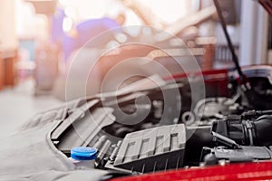 Concept closeup car repair service. Auto mechanic working in garage