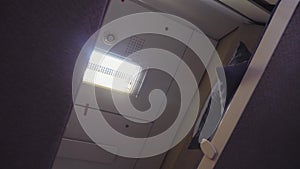 Concept coach train journey travel. moving train railway view of the carriage compartment ceiling . interior inside