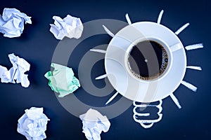 Concept coffee awakens brain on dark background top view