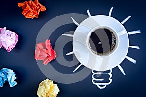 Concept coffee awakens brain on dark background top view