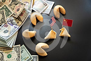 Concept of commercial war between USA and China, with dollar bills and flags of the capitalist countries and biscuit photo