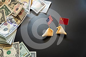 Concept of commercial war between USA and China, with dollar bills and flags of the capitalist countries and biscuit photo