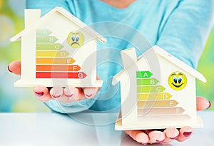 Concept comparison between normal house and low consumption house with energy efficiency rating