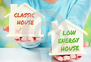 Concept comparison between normal house and low consumption house with energy efficiency rating