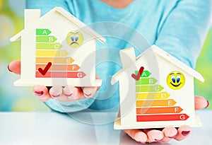 Concept comparison between normal house and low consumption house with energy efficiency rating