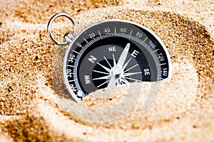 Concept compass in sand searching meaning of life