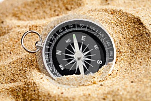 Concept compass in sand searching meaning of life