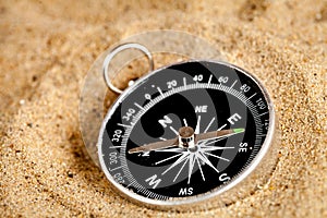 Concept compass in sand searching meaning of life