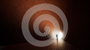 Concept or conceptual dark tunnel with a bright light at the end or exit as metaphor to success, faith, future or hope, a black