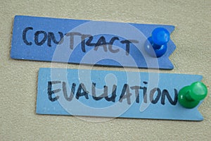 Concept of Contract Evaluation write on sticky notes isolated on Wooden Table