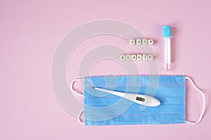 Concept control your health. Test tube for blood analysis mask and thermometer lettering