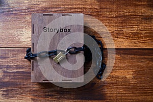 Concept for copyright, patent or intellectual property and idea protection.Box wrapped with chain on lock.