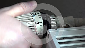 Concept of cost reducing by adjusting the heating by using the thermostat