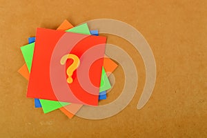 The concept of counseling for problems, solutions, and confusion is symbolized by a question mark on colorful paper